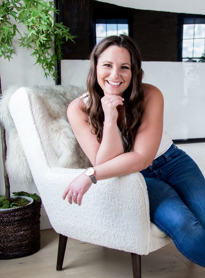 Alicia McClure, founder of Bundled, smiling in her home | Bundled founder story, affordable sustainable childrenswear Canada